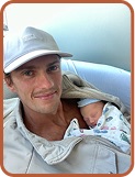 Byron holding newborn baby — shared on WeCanvas